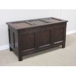 A 17th Century oak Coffer with panelled top and lozenge carved panelled front, 4ft 1in