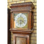 An 18th Century walnut Longcase Clock with square brass dial by Sam Butternoy, the case decorated