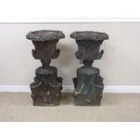 A pair of glazed stoneware two handled Garden Urns with leafage moulded rims above naturalistic bark