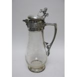 A Victorian silver mounted and lidded glass Claret Jug with fruiting vine etching, lion rampant