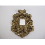 A small 19th Century gilt framed Mirror with floral and scroll surround, 15 x 11in