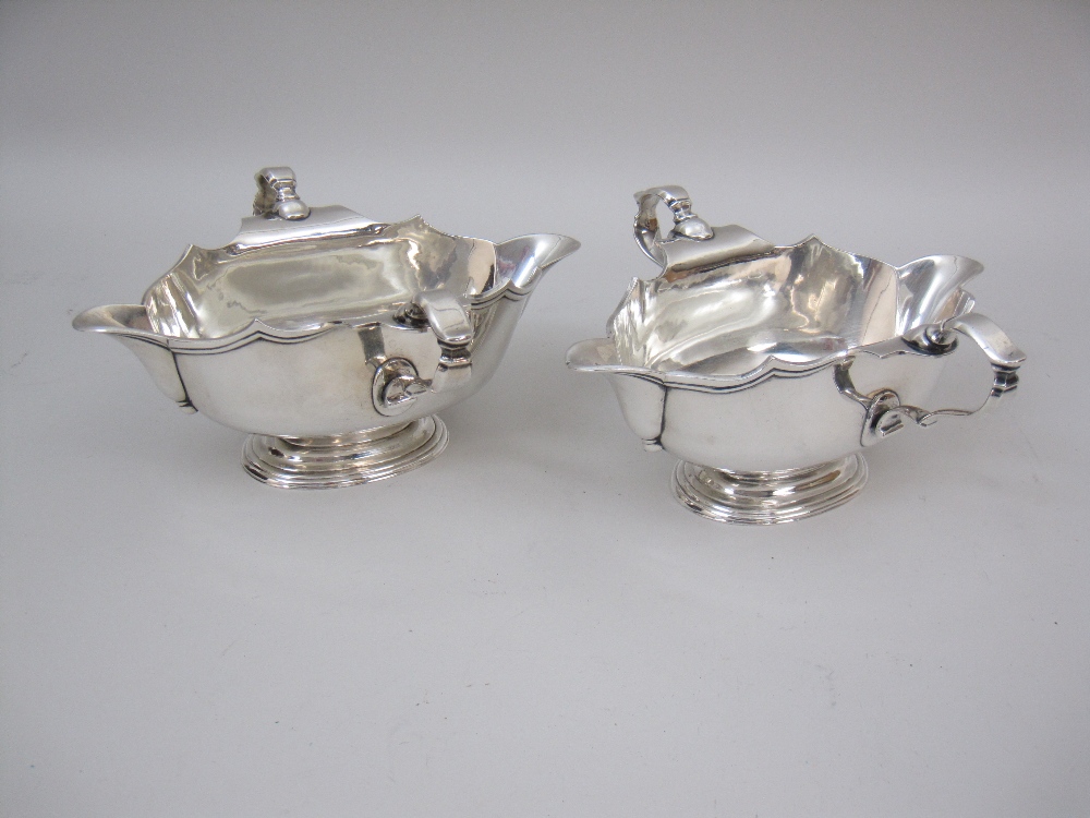 A pair of George V silver double lipped two handled Sauce Boats on oval bases, London 1934, maker: