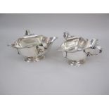 A pair of George V silver double lipped two handled Sauce Boats on oval bases, London 1934, maker: