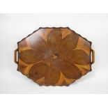 A yew wood octagonal two handle Tray with shaped rim, 23in