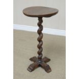 A late Georgian oak Pillar Table with octagonal top having rope twist border and frieze of acorn