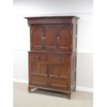 A 19th Century Welsh oak Court Cupboard with three recessed cupid's bow panelled doors fronted by