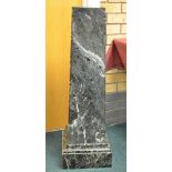 A green variegated marble Torchere of tapering form on square base, 3ft 2in H