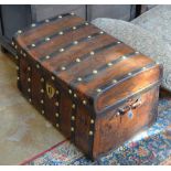 A 19th Century leather Trunk with tulip decoration and brass rivetted iron strapping, 2ft 6in W x