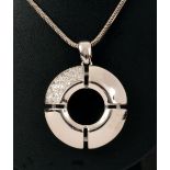 A contemporary circular Diamond Pendant pavé-set numerous brilliant-cut stones in 18ct white gold by