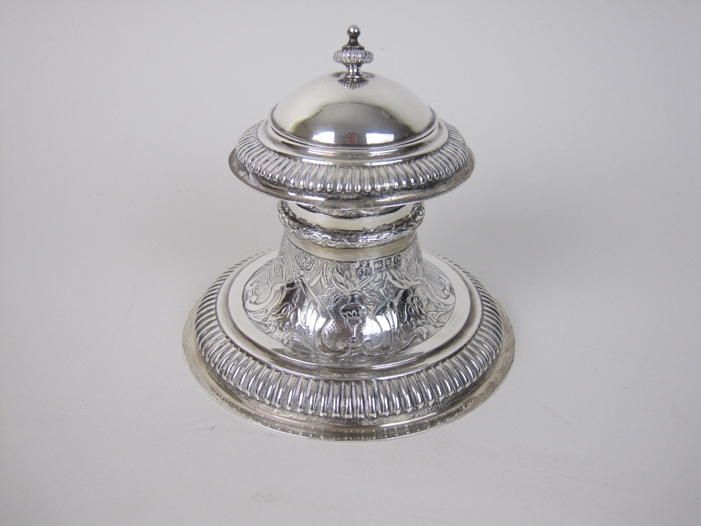 An Edward VII silver circular Capstan Inkstand with floral and strapwork embossing, hinged lid,