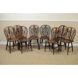 A set of eight Windsor Dining Chairs with stick and wheelbacks, solid seats on turned supports