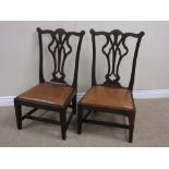 A pair of Chippendale style oak Child's Chairs with shaped top rails, upholstered drop-in seats on