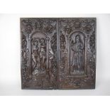 A pair of 17th Century oak Panels carved figures within arches, mask, fruit and bird surround, 21