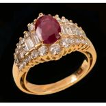 A Ruby and Diamond Ring claw-set oval-cut ruby between rows of channel-set graduated baguettes and