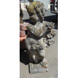 A stone Statue of a Cherub with roses, 2ft 8in H