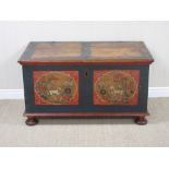 A 19th Century Continental painted pine Blanket Box with oval reserves of sheep and flowers with red