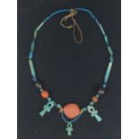 An Egyptian hardstone and blue glazed composition Bead Necklace, Late Period - Ptolemaic, with three