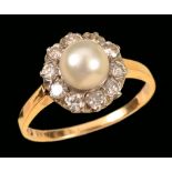 A Cultured Pearl and Diamond Cluster Ring set central pearl within frame of pavé-set eight-cut