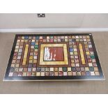 A low Conservatory Table with pietra dura inlaid top including malachite, lapis, etc on iron