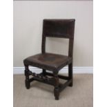 A 17th Century oak Side Chair with brass studded leather back and seat on turned and square front