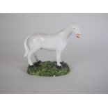 A Derby porcelain white Horse standing on green painted oval base, 3 1/2 in, A/FFOOTNOTE: A