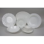 A Wedgwood and Coalport 'Countryware' Dinner Service of moulded cabbage leaf design in white, approx
