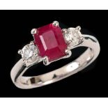 A Ruby and Diamond three stone Ring corner claw-set step-cut ruby, 1.88cts, between two brilliant-