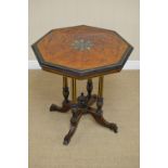 A Victorian octagonal Occasional Table with central inlay of masks and leafage, birds eye maple