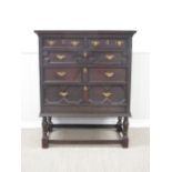 A Jacobean style oak Chest of two short and three long drawers on later turned stand, 3ft 7in W x