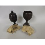 Two Whale Eardrums and two treen pedestal Goblets, one with lid, 7 1/4 in and 6 1/2 in