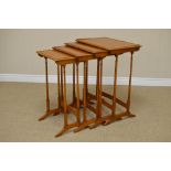 A set of four satinwood Quartetto Tables, each with a beaded rectangular top above slender turned