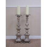 A pair of 17th Century style Pricket Candlesticks of triangular section with leafage design,