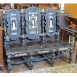 A 19th Century ebonised Settle in the 17th Century style with three panel back decorated with inlaid