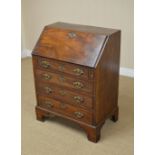 An 18th Century mahogany Bureau, the moulded fall revealing a fitted interior of pigeon holes and