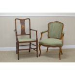 A Louis XV style French Fauteil with upholstered back, arms and seats on cabriole front legs, and an