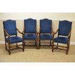 A set of Carolean style oak framed Elbow Chairs with blue upholstered backs and seats, scroll arms