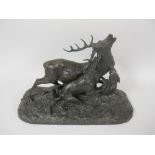 MENE; A bronze of a Stag being attacked by three dogs, 18in, signed