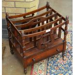 A 19th Century mahogany Canterbury with lyre frieze and slatted divisions on turned legs and