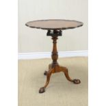 A 19th Century mahogany Pillar Table with circular pie-crust top, bird cage support on turned and