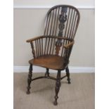 A 19th Century ash and elm Windsor Chair with pierced splat and stick back, solid seat on turned