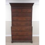 An 18th Century Welsh oak Chest on Chest with dentil and carved frieze above carved drawer, two