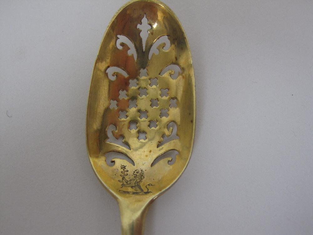 An 18th Century silver-gilt Mote Spoon with saltire cross and scroll piercing, engraved crest - Image 2 of 3