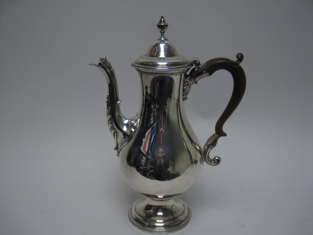 A George III silver Coffee Pot of baluster form, the domed lid with urn finial, ornate spout, scroll - Image 3 of 10