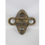 A Boa war Mask, wood with dark and light pigment, Upper Congo