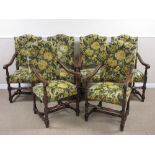 A set of six Carolean style oak framed Elbow Chairs with blue and yellow floral upholstered backs