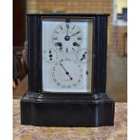 A 19th Century black slate Mantel Clock with time, day, date and month dials, 13in H x 11in W