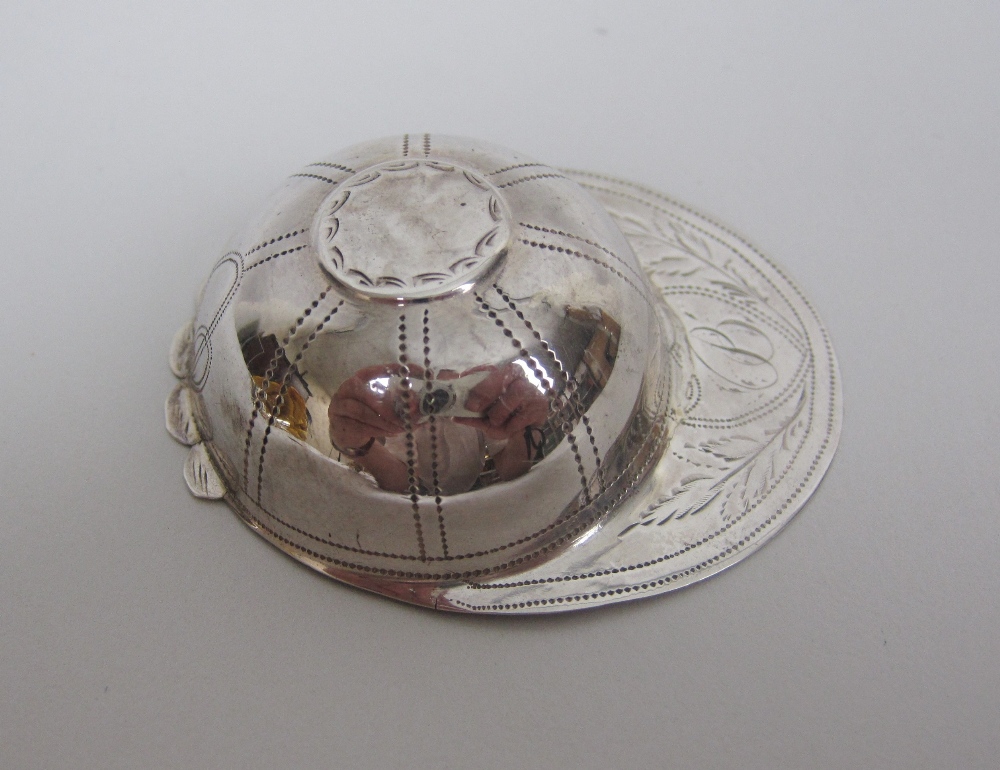 A George III silver Caddy Spoon in the form of a jockey's cap with leafage engraving and initial