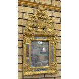 An antique gilt framed Wall Mirror with detachable urn of flowers surmount, four mirror panels