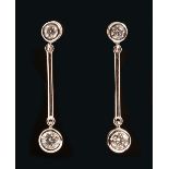 A pair of Diamond Earrings each rub over-set single brilliant-cut stone above bar and larger stone