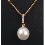 A Cultured Pearl and Diamond Pendant having large cultured pearl suspended below row of pavé-set